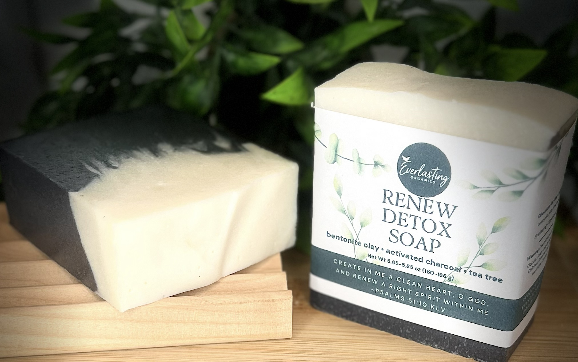 Two Renew Detox Soap bars showing activated charcoal black and cream swirl beside Everlasting Organics labeled bar