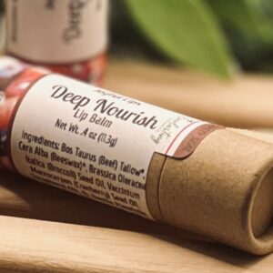 Side view of Deep Nourish tallow and cranberry seed oil lip balm in natural kraft tube by Everlasting Organics
