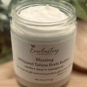 Open jar of Body Blessings whipped tallow body butter showing the creamy whipped texture, Madagascar vanilla scent, grass fed tallow skincare