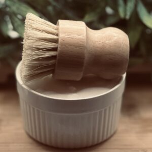 Handmade cold process solid dish soap set with bamboo brush resting on white ceramic ramekin, Morning Bloom scent with French lavender warm honey and herbes de Provence, Everlasting Organics Abiding Home collection