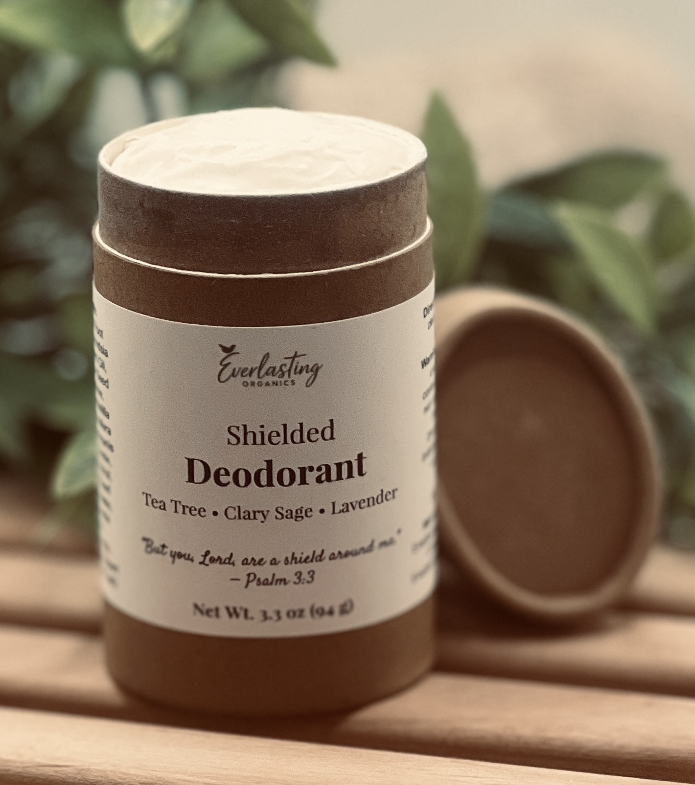 Everlasting Organics Shielded natural solid deodorant essential oil blend tea tree clary sage lavender open top showing smooth creamy vegan aluminum-free formula in biodegradable push-up container